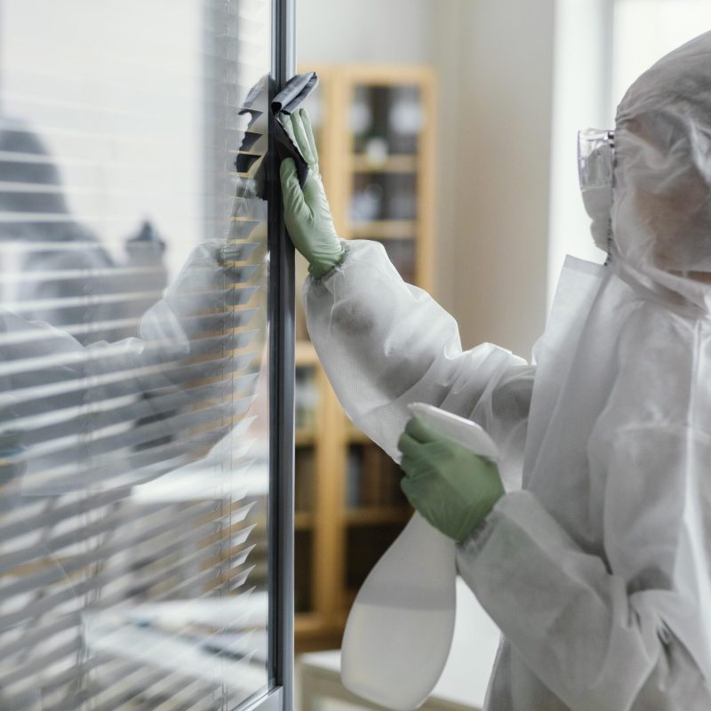 people-disinfecting-biohazard-area